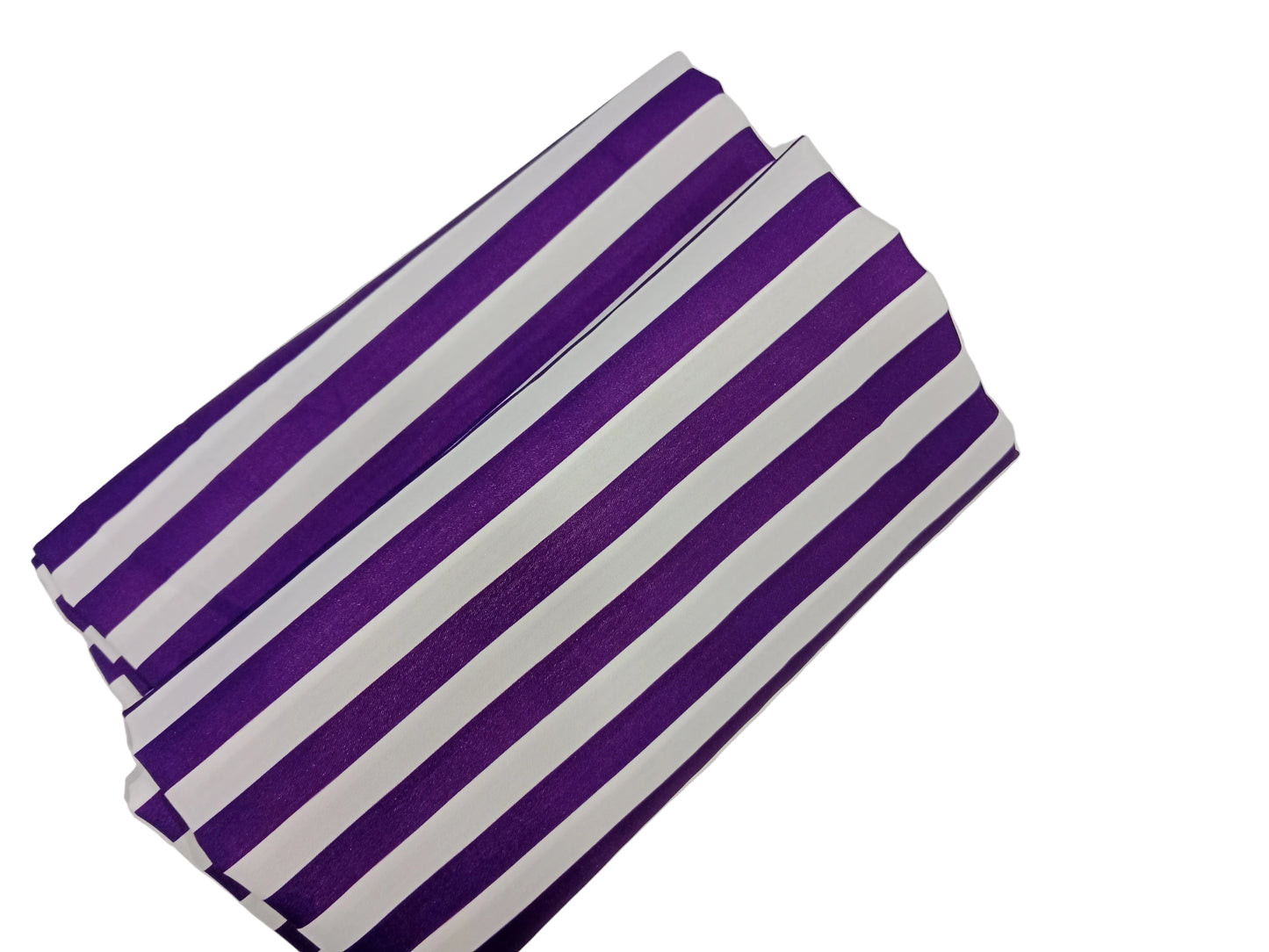 Purple and white striped fabric on a gray background
