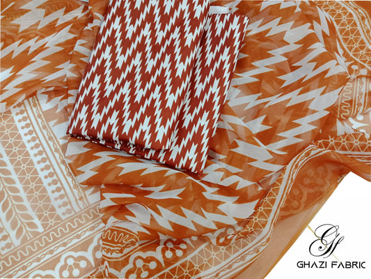 Patterned fabric with a pillow, branded 'Ghazi Fabric'.