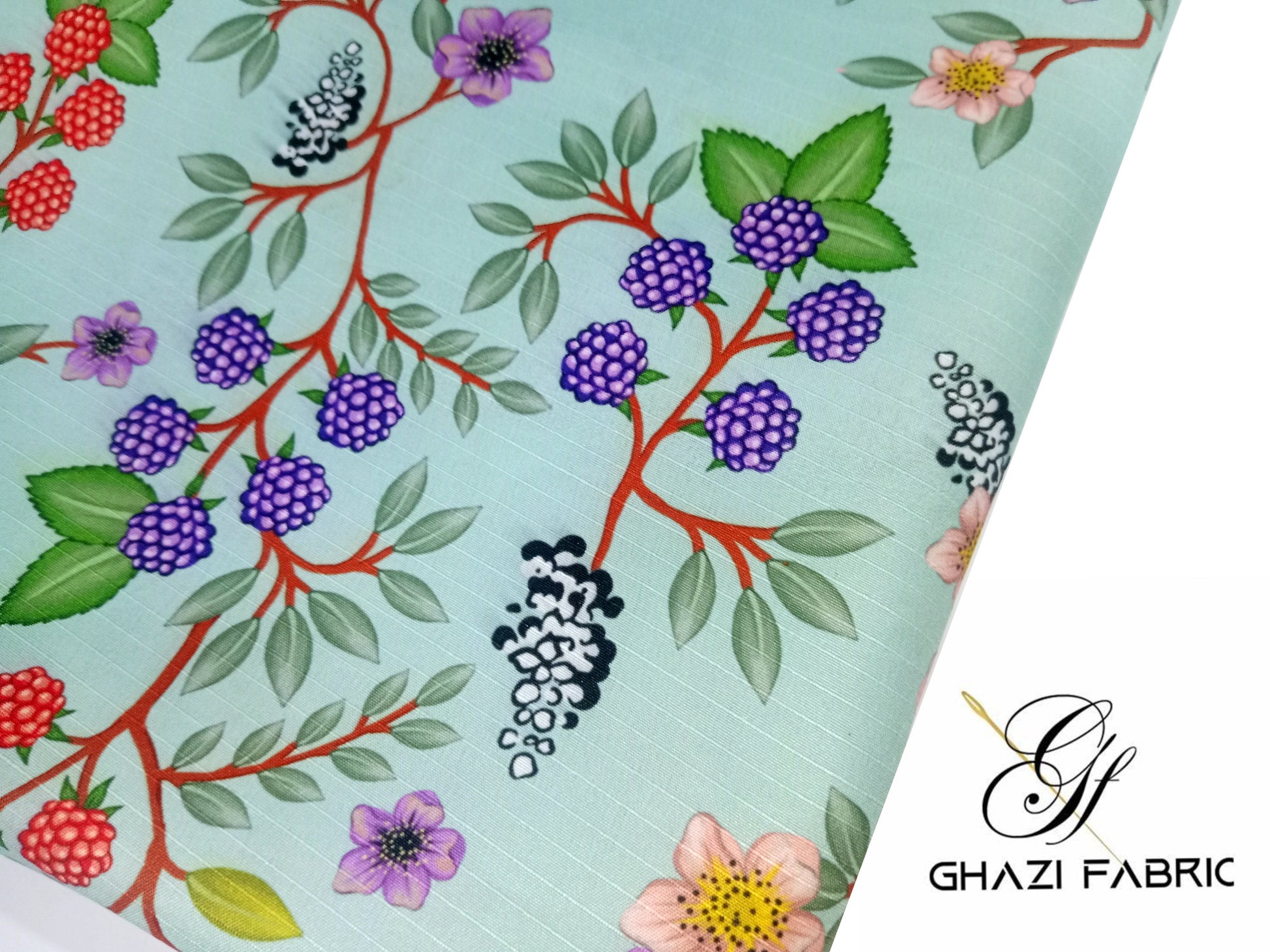 Floral and berry patterned fabric with Ghazi Fabric logo.