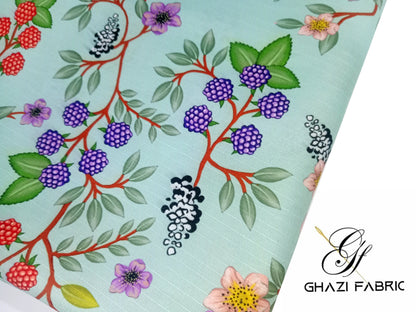 Floral and berry patterned fabric with Ghazi Fabric logo.