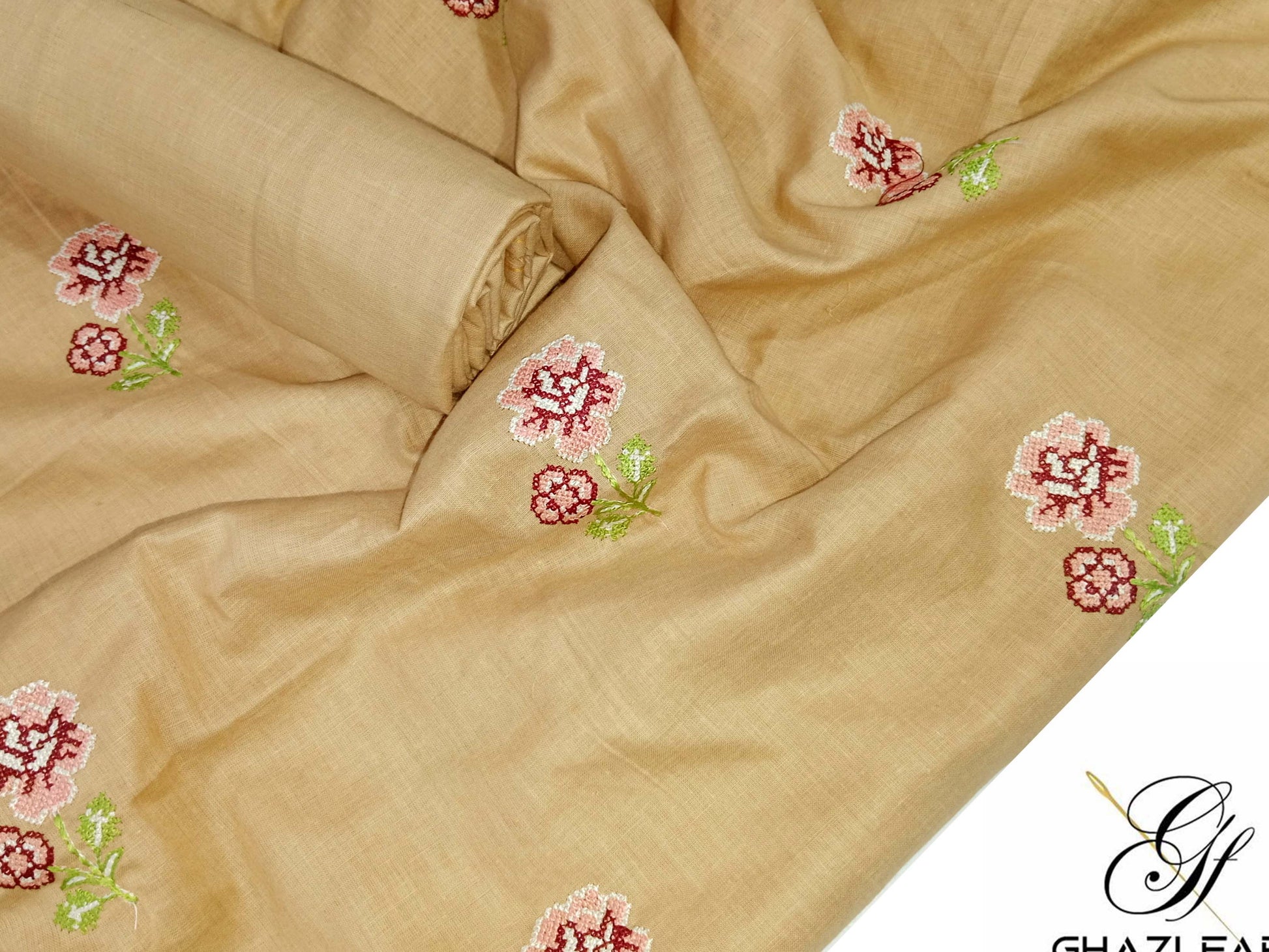 Beige fabric with floral embroidery, branded as Ghazi Fabric.