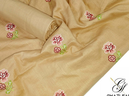 Beige fabric with floral embroidery, branded as Ghazi Fabric.