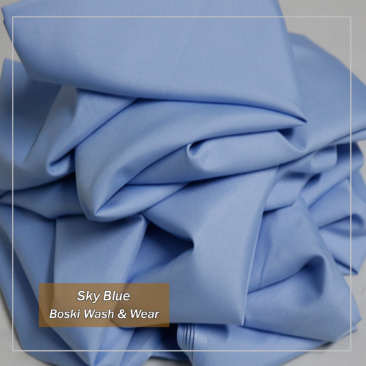Stack of sky blue fabric with 'Boski Wash & Wear' label
